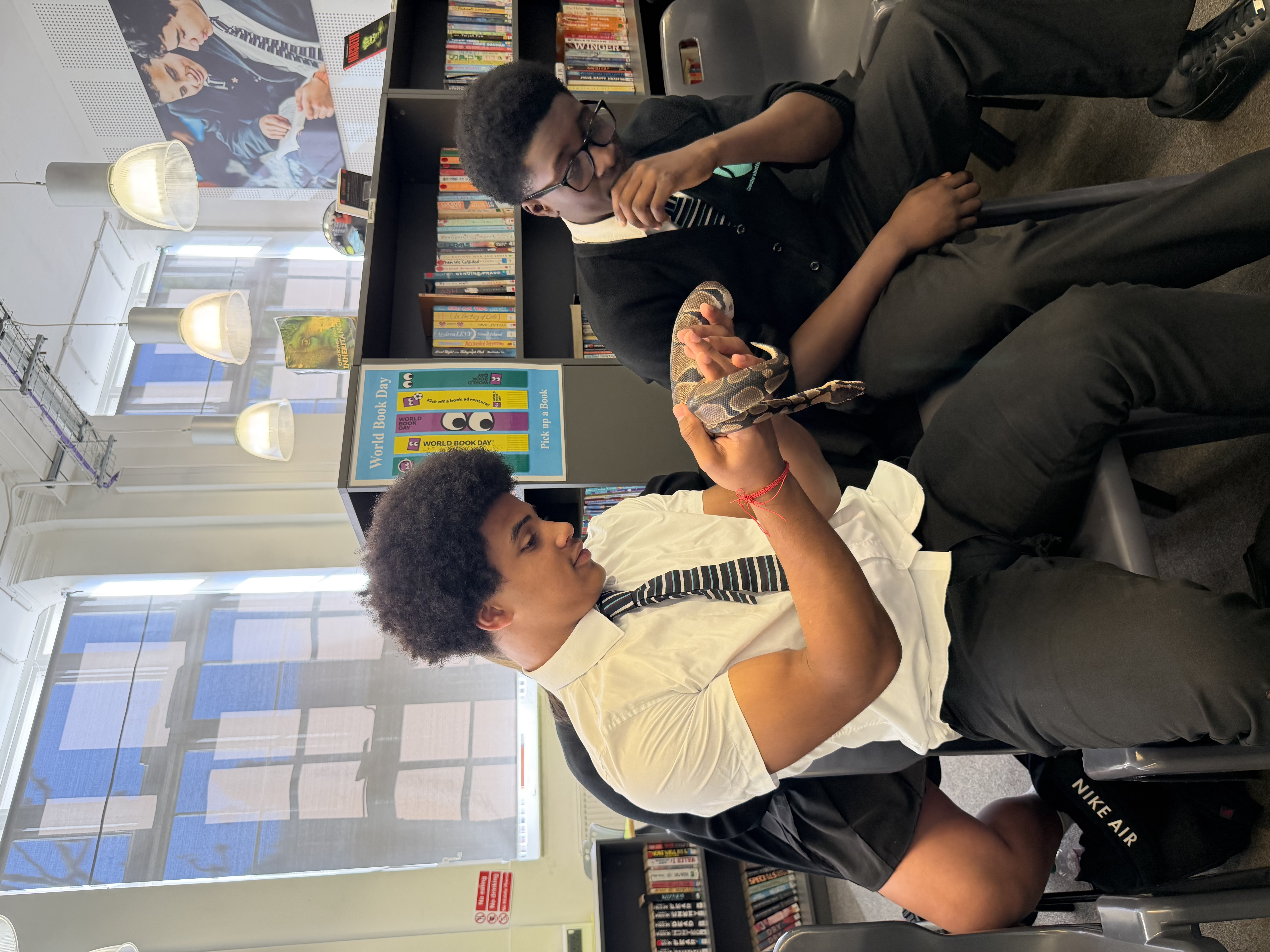 Students holding snake