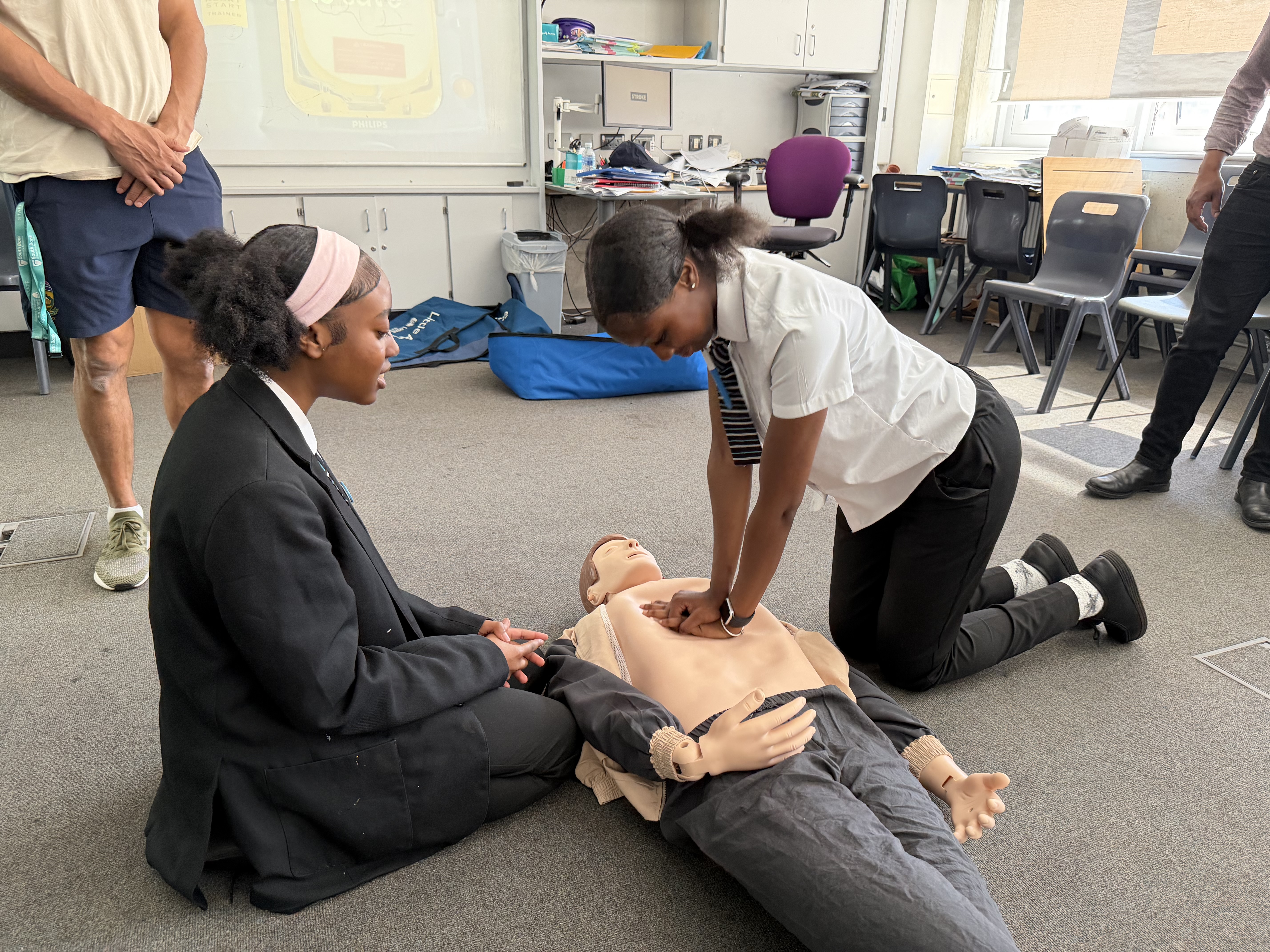 Students performing CPR