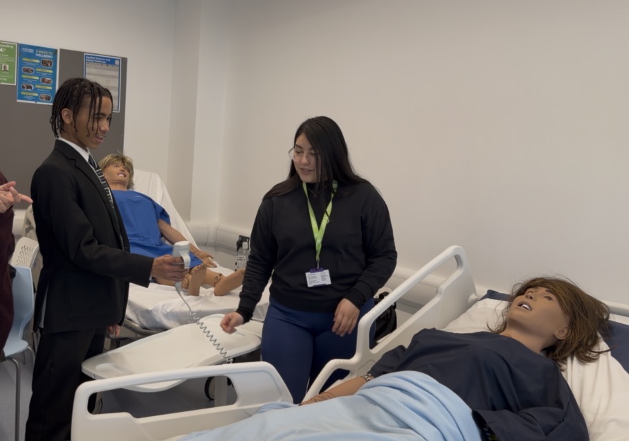 Student learning how to operate the bed