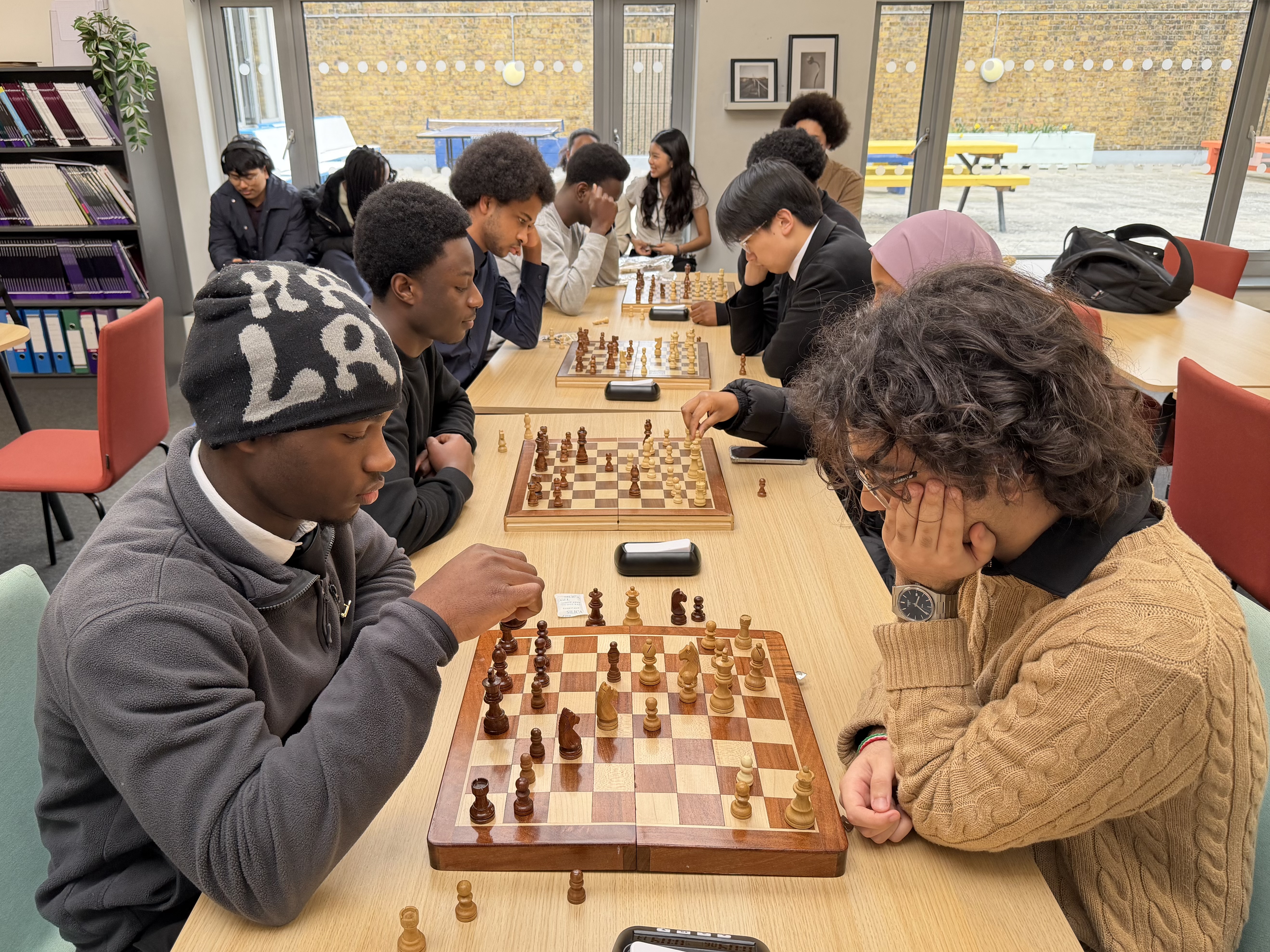 A group of students playing chess