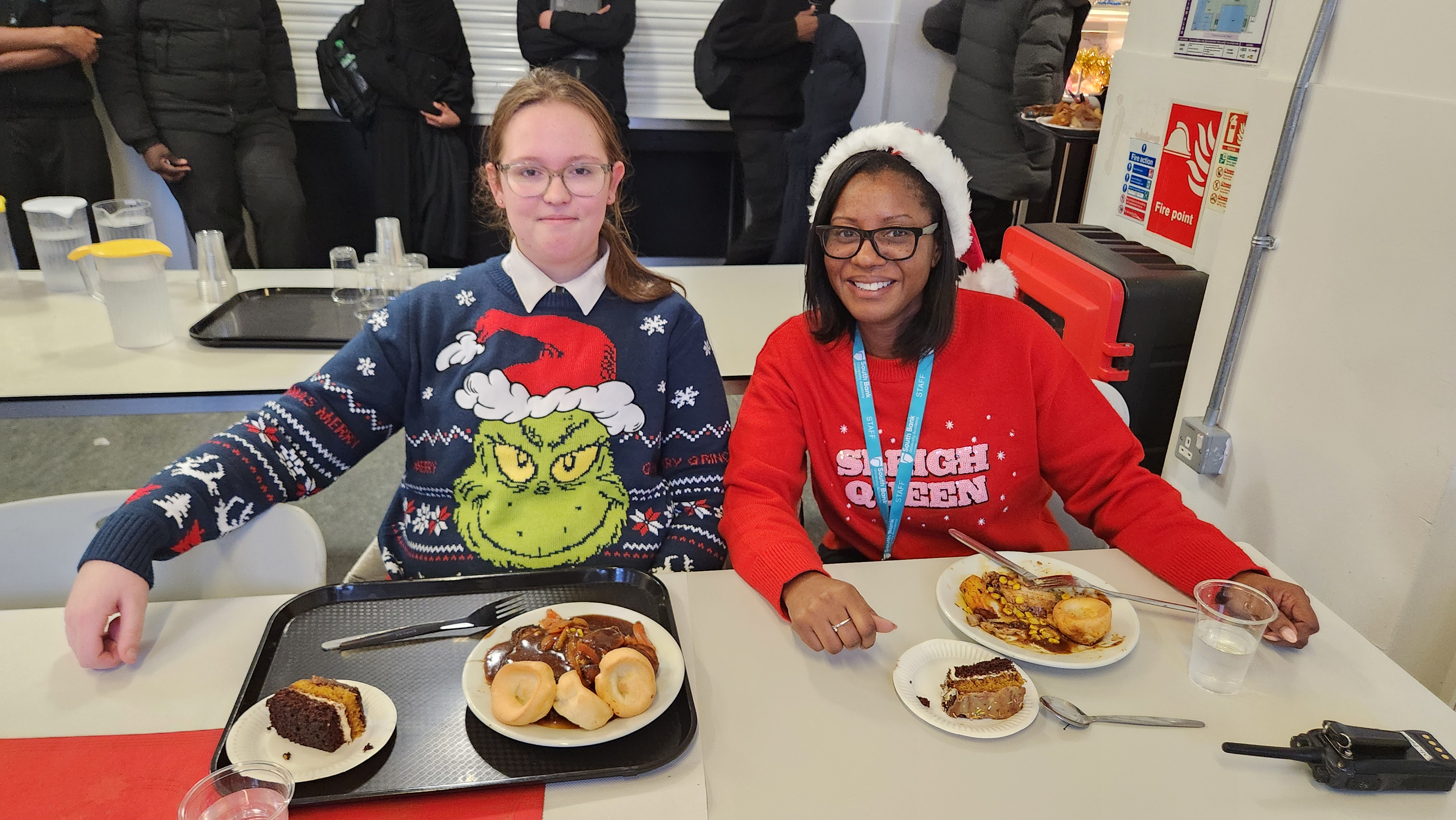 Student and Principal having Christmas dinner together
