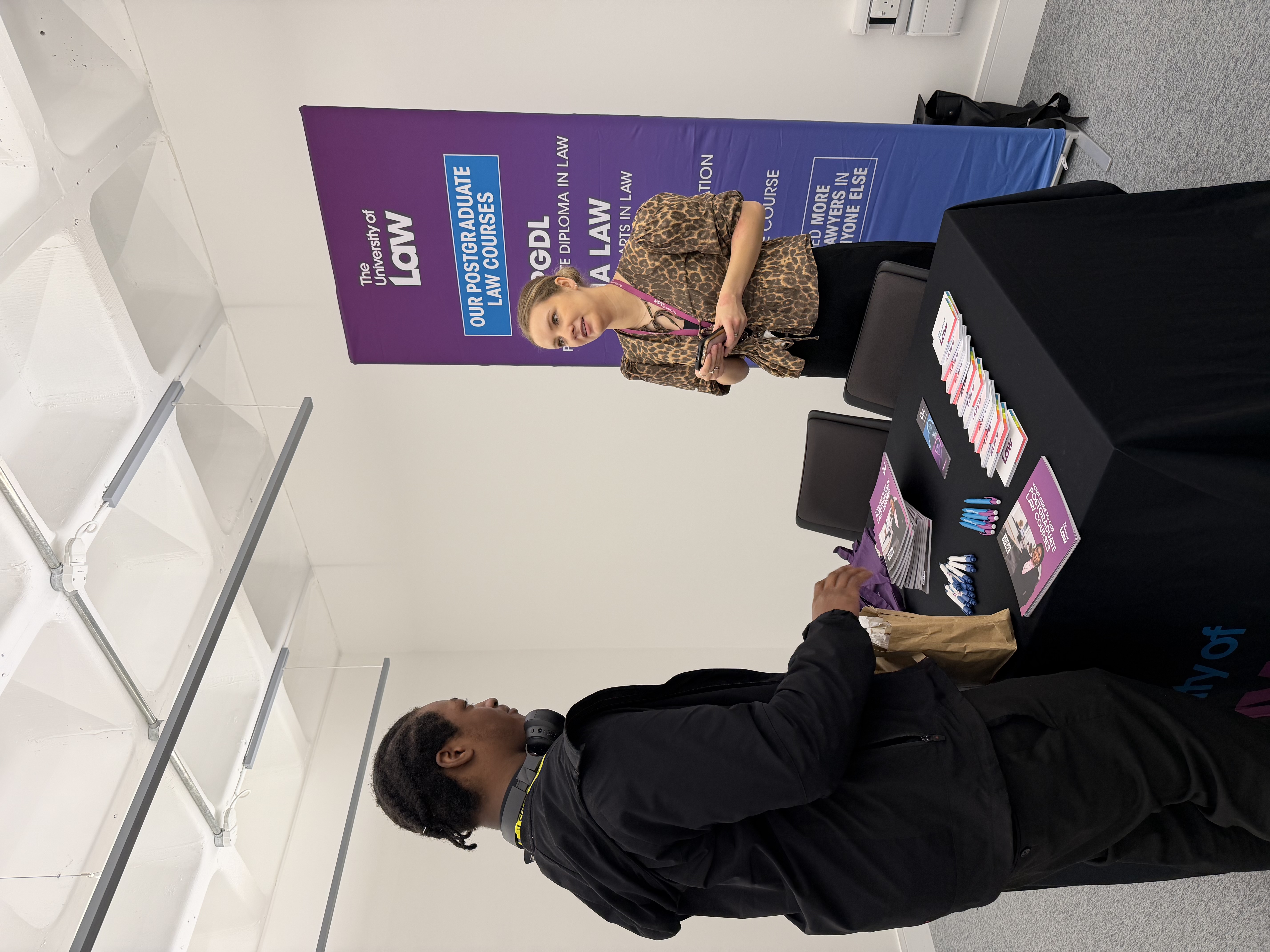 Student speaking to a employer during a law career fair