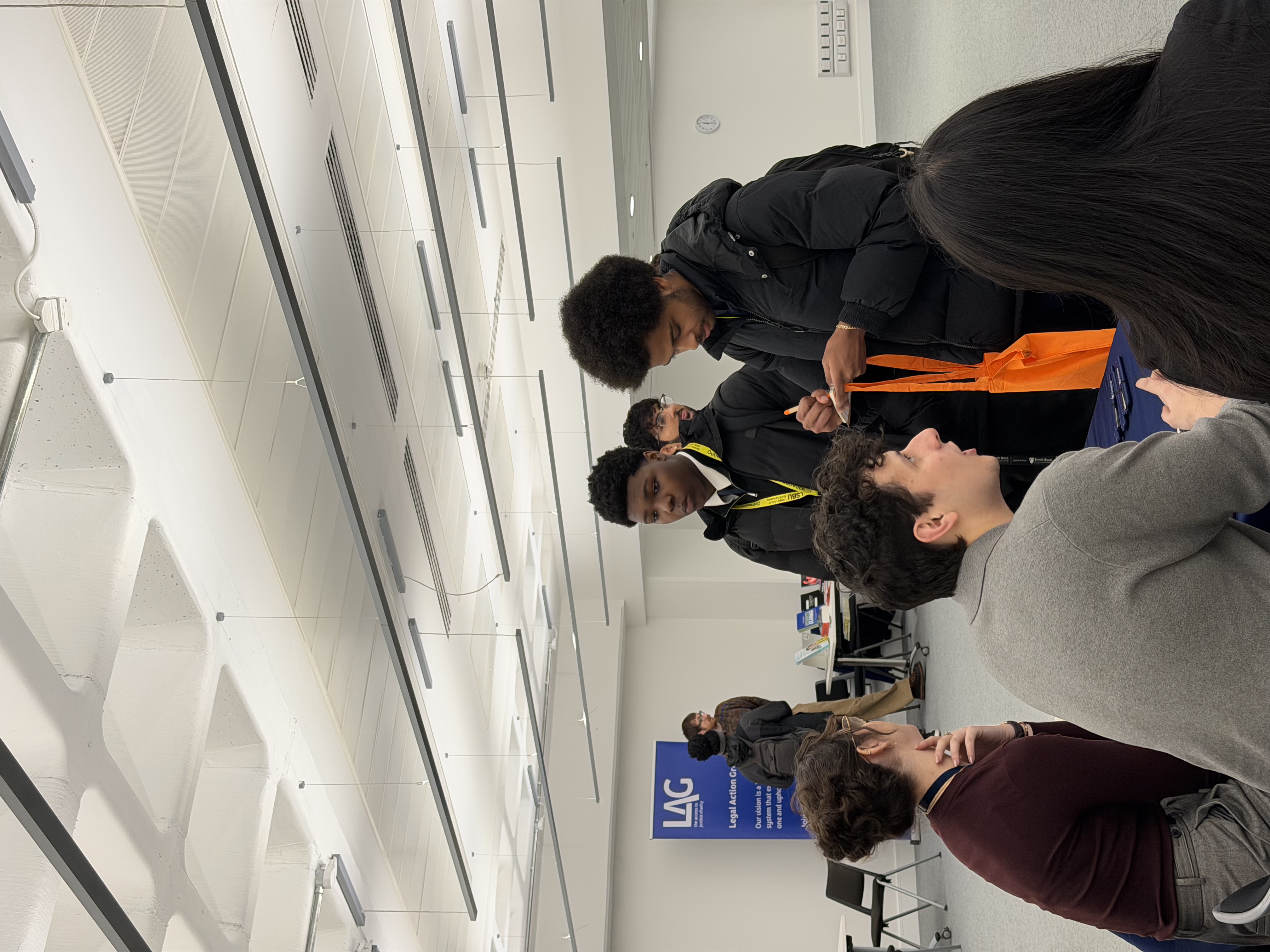 Students in a conversation with employers from the law fair