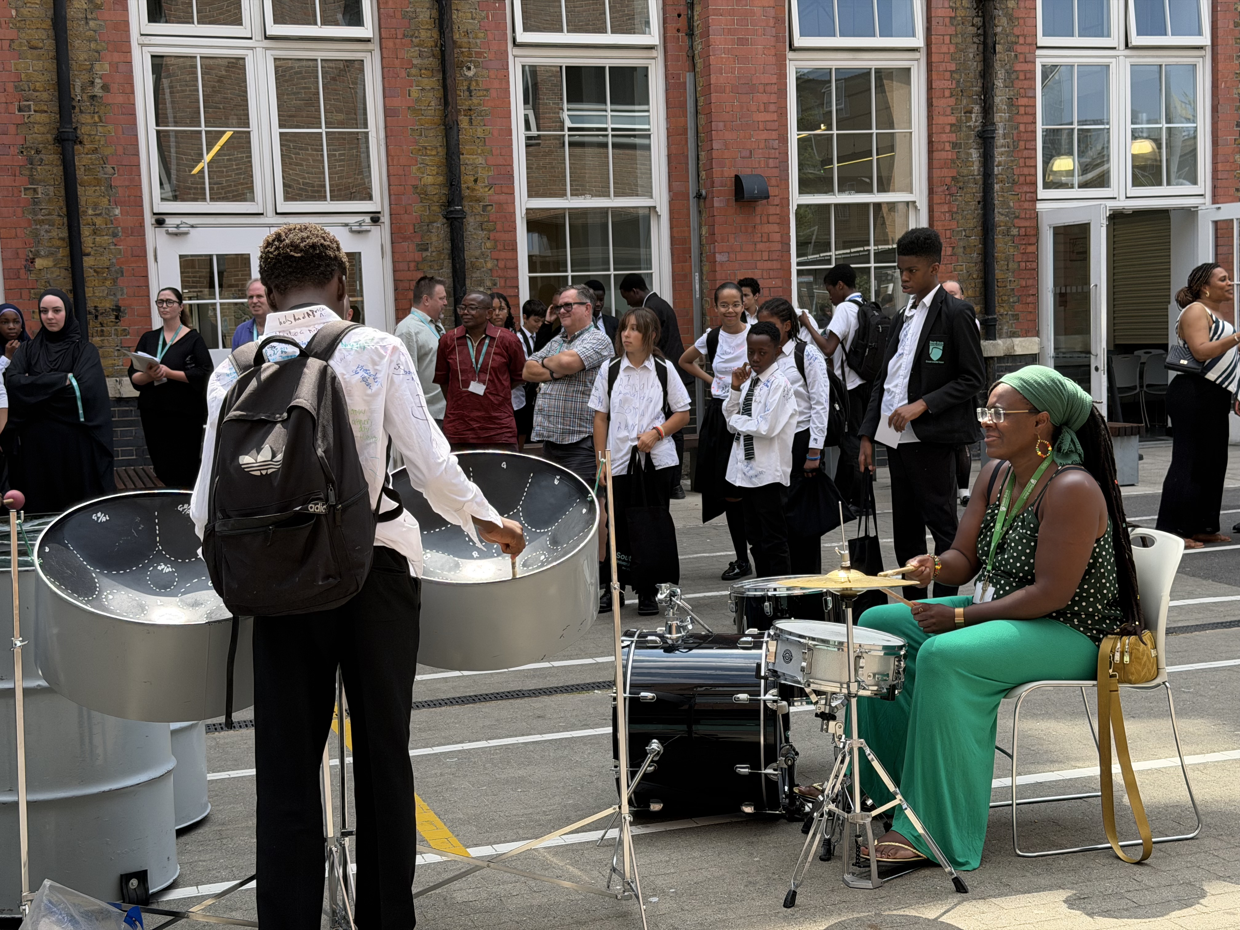 Ms James playing drums