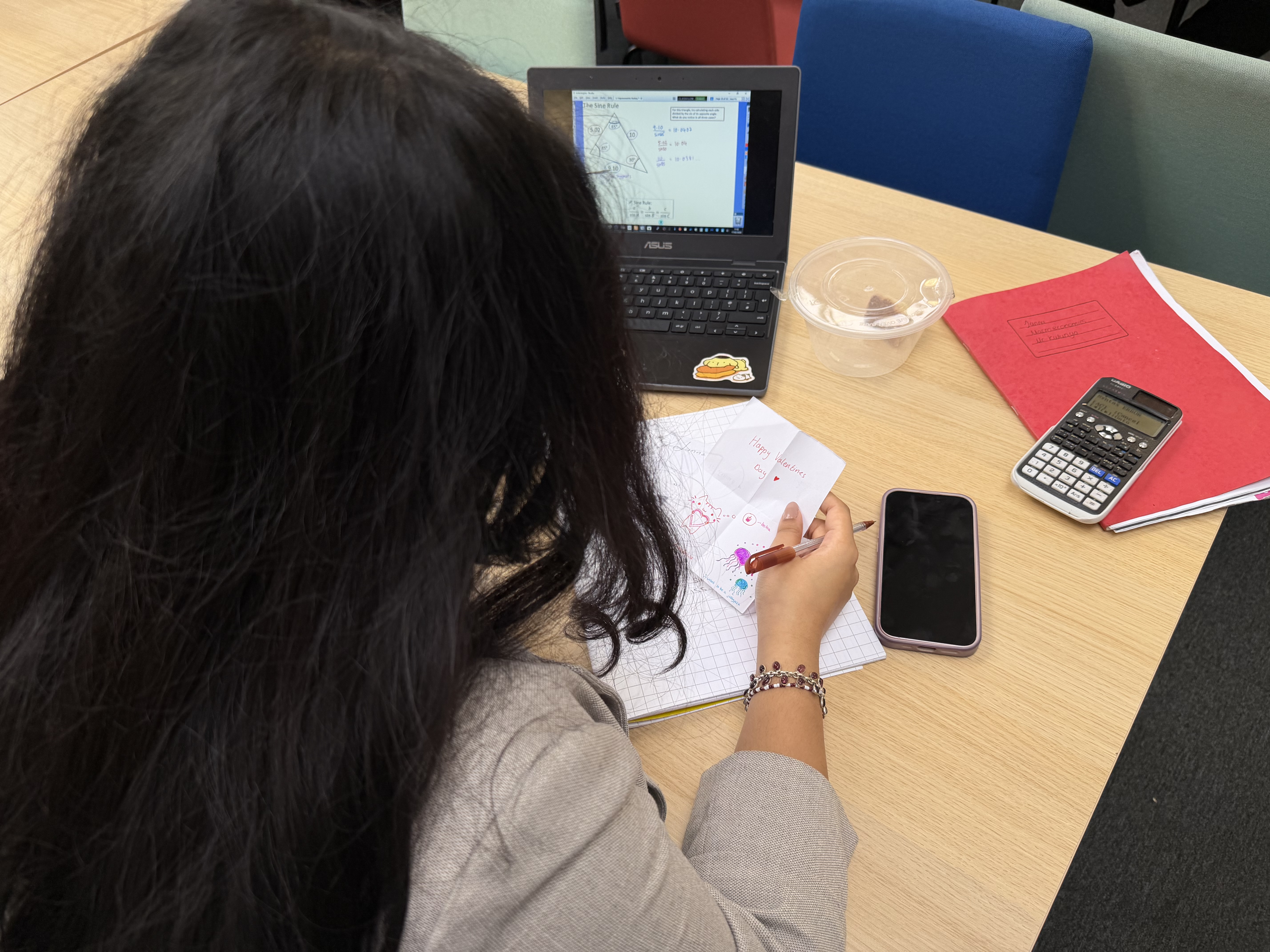 Female student reading a note