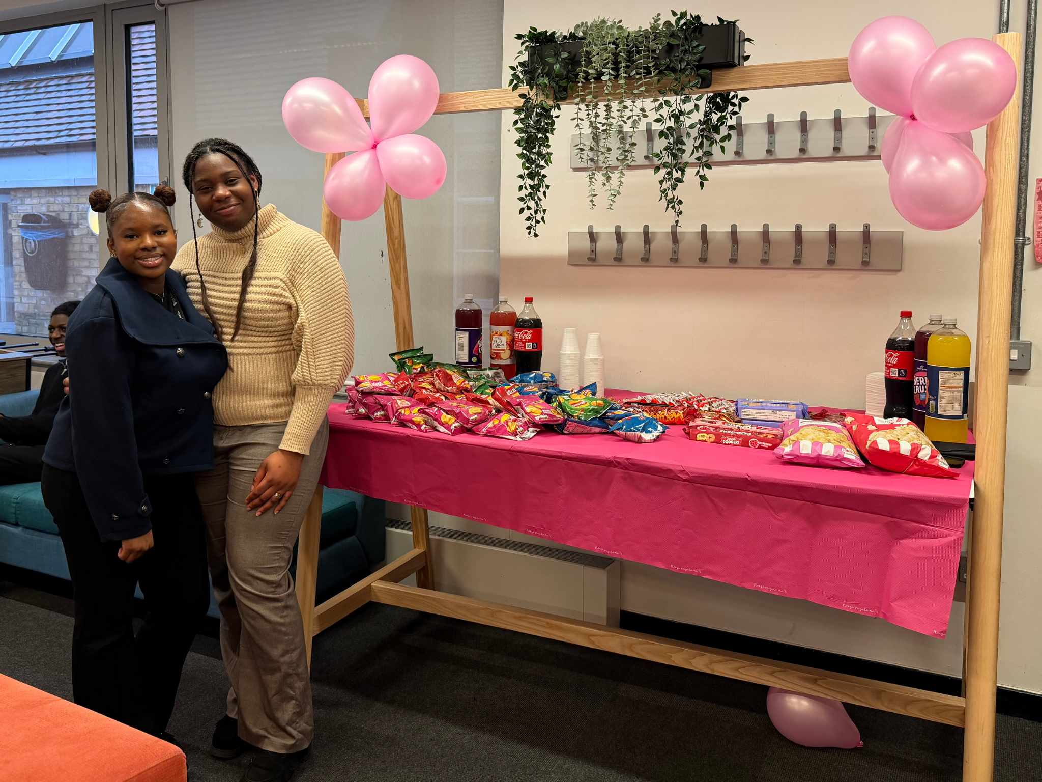 Two students prepared a table of snacks