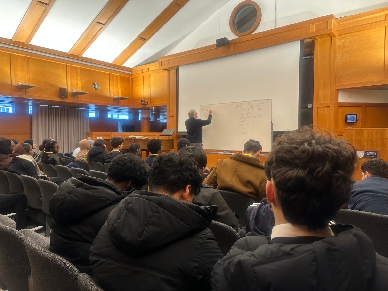 Students listening to a lecture in Trinity College Cambrige