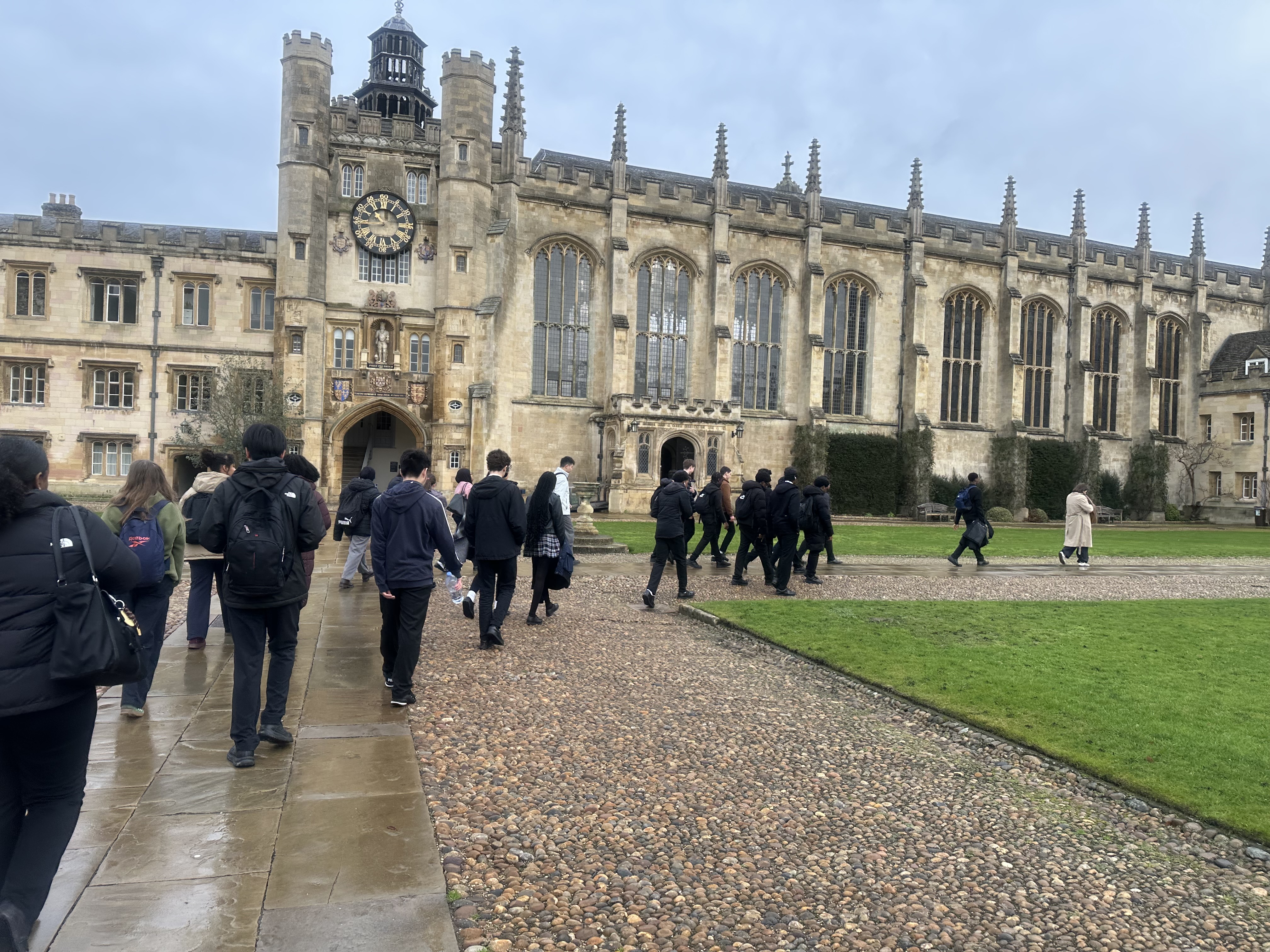 Students walking around the campus of the Trinity College Cambridge