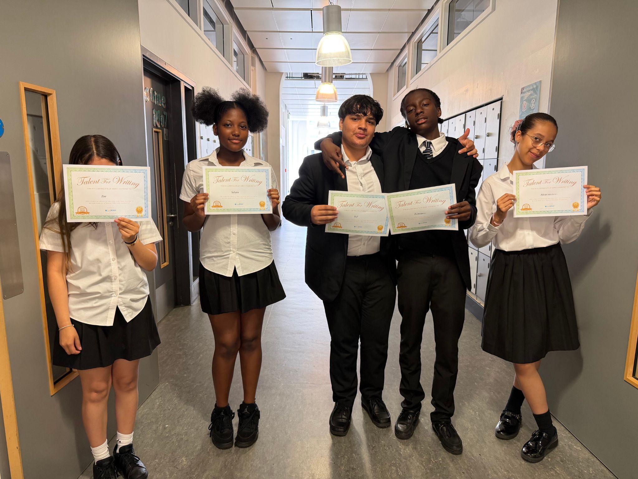 Young_Writers Students Holding on to Certificate