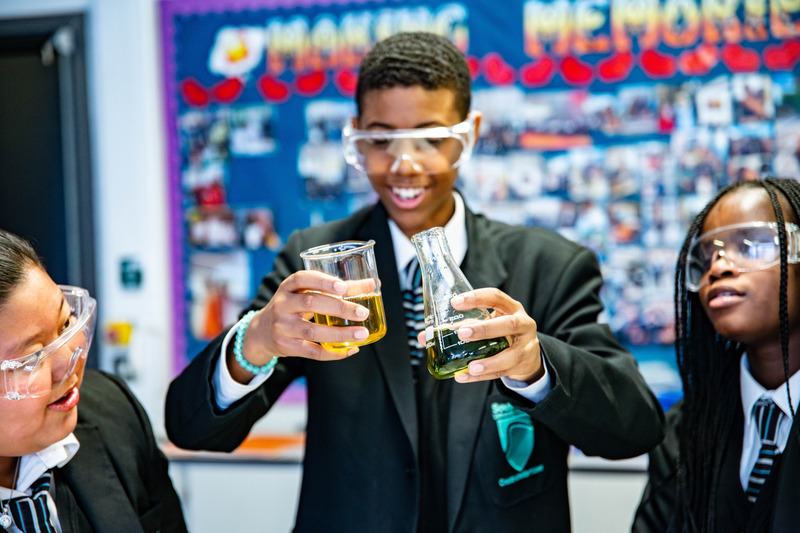 Student watching chemical reaction