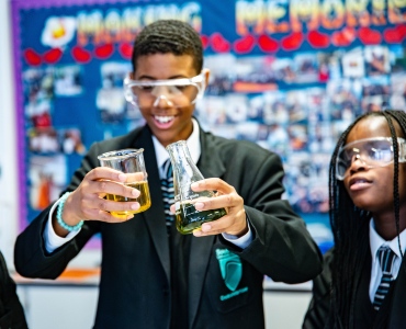 Students watching chemical reaction