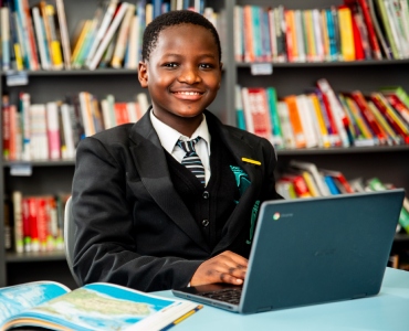 Student in library smiling