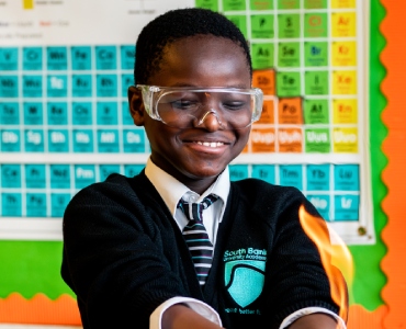 Student with fire in hands
