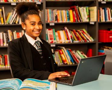 Smiling student in library