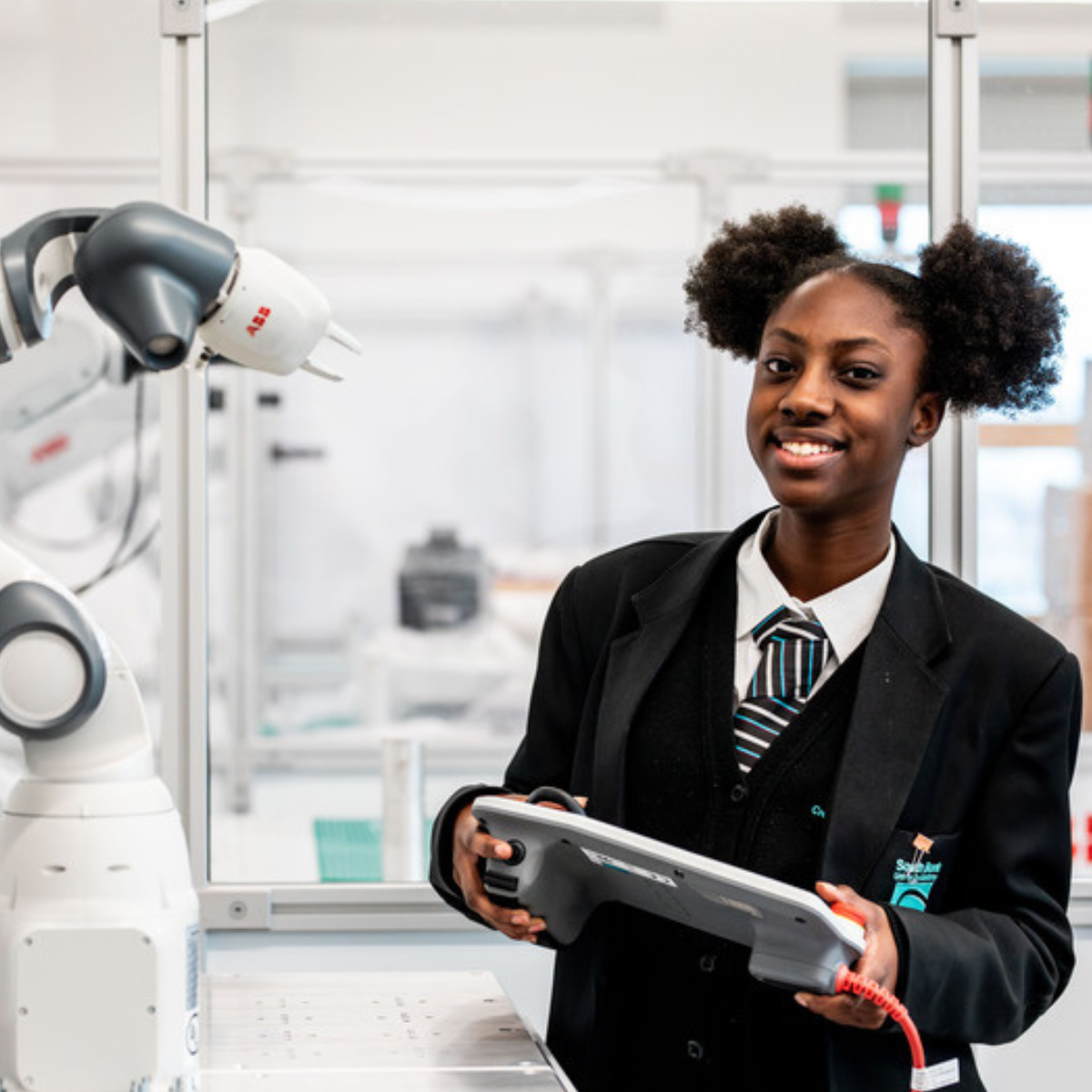 Smiling student standing in outdoor area