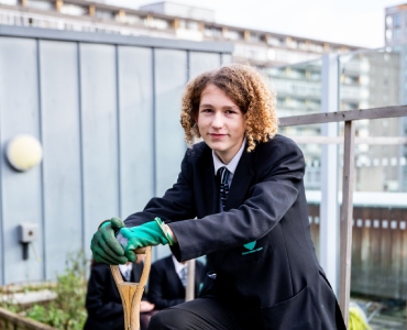 Smiling student standing in outdoor area