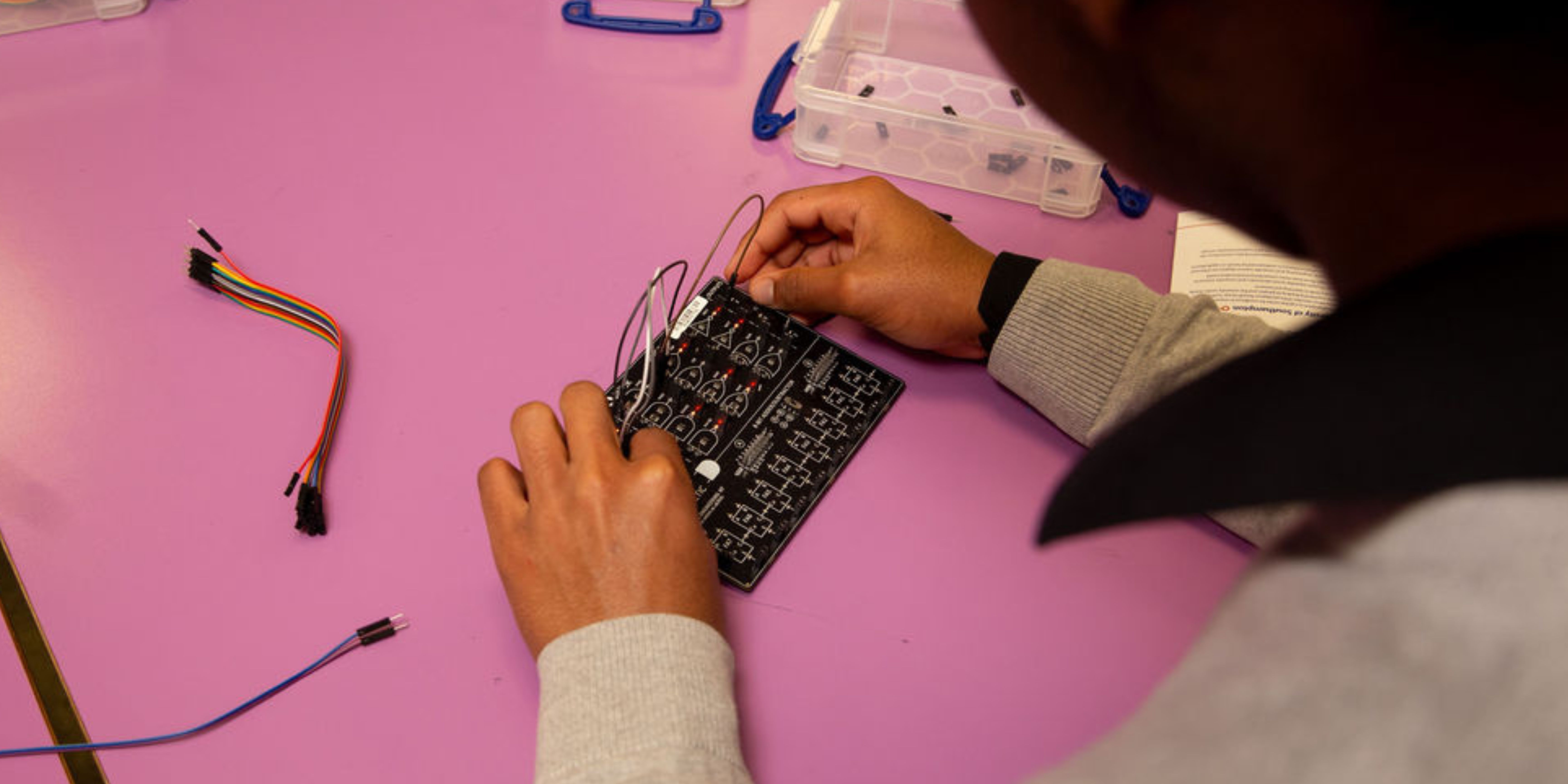 Banner image of student working on a appliance